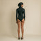 Black, fitted, long sleeve bodysuit has cutaway detail on front.