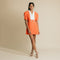 V-neck, button up jacket dress featuring cutaway back with white big ribbon.    