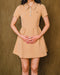 Neutral, daily dress has short sleeve and button up collar.