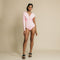 Light pink, one arm, long sleeve, ruched on chest bodysuit.