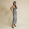 Shiny, grey color, sequin, long dress has on front cross over, rhinestone straps details.