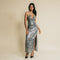 Shiny, grey color, sequin, long dress has on front cross over, rhinestone straps details.