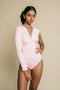 Light pink, one arm, long sleeve, ruched on chest bodysuit.